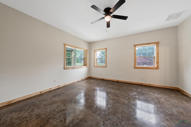 9089 Raspberry Ave, Frankston, TX 75763 - unfurnished room featuring finished concrete floors, healthy amount of natural light, and baseboards