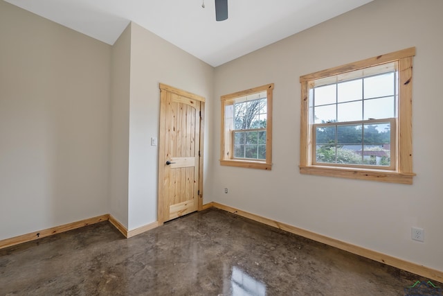 9089 Raspberry Ave, Frankston, TX 75763 - unfurnished bedroom with baseboards, finished concrete flooring, and ceiling fan