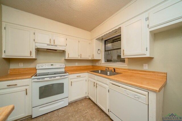 308 N Lee Dr, Gladewater, TX 75647 - kitchen featuring white appliances, under cabinet range hood, a textured ceiling, light countertops, and white cabinets