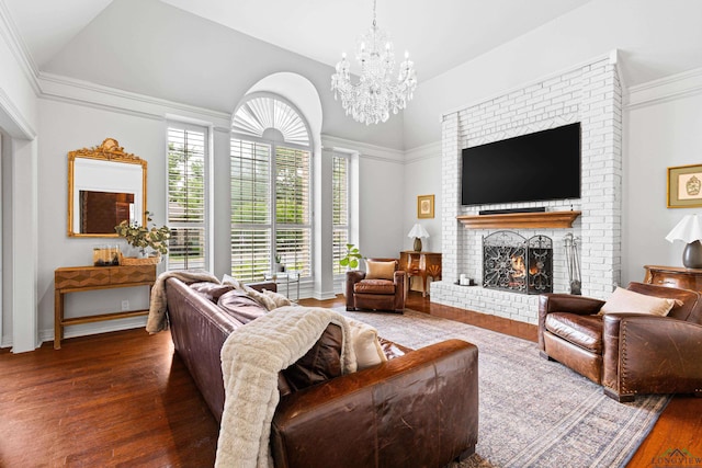 6307 Shady Oaks Dr, Tyler, TX 75703 - living area with wood finished floors, a chandelier, a fireplace, and vaulted ceiling