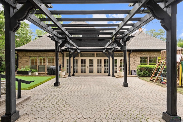 6307 Shady Oaks Dr, Tyler, TX 75703 - view of patio / terrace with french doors, a pergola, and a putting green