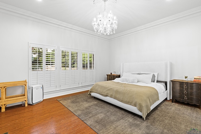 6307 Shady Oaks Dr, Tyler, TX 75703 - bedroom with a chandelier, ornamental molding, and wood finished floors
