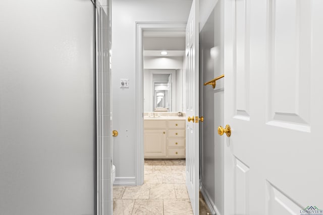 6307 Shady Oaks Dr, Tyler, TX 75703 - corridor with baseboards and a sink