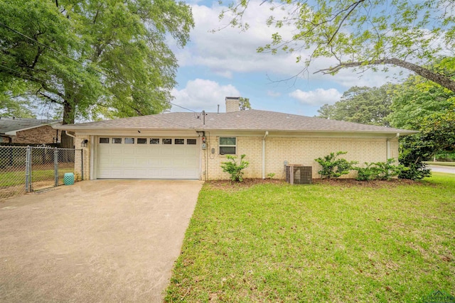 ranch-style home featuring brick siding, fence, a front yard, and a garage