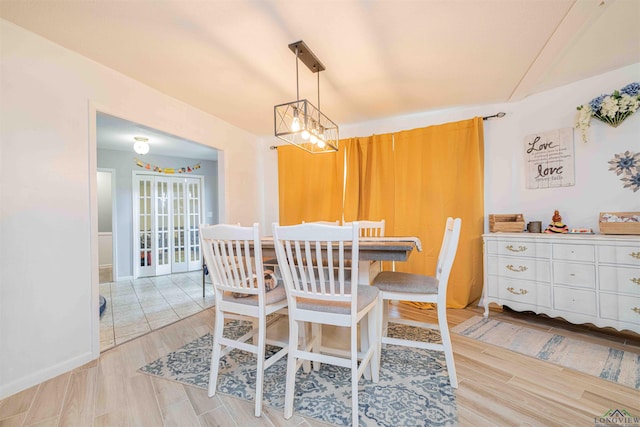 dining area featuring light wood finished floors