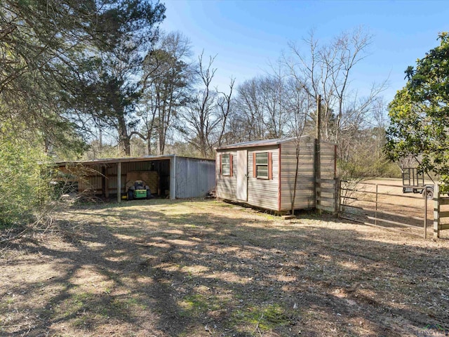 view of pole building with fence