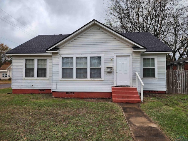 bungalow-style house with a front yard