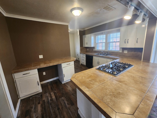 kitchen featuring white cabinets, dishwasher, built in desk, and stainless steel gas stovetop