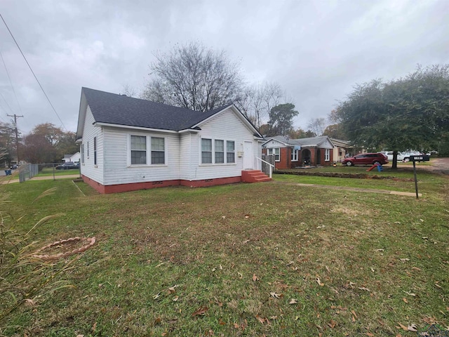 view of home's exterior featuring a yard