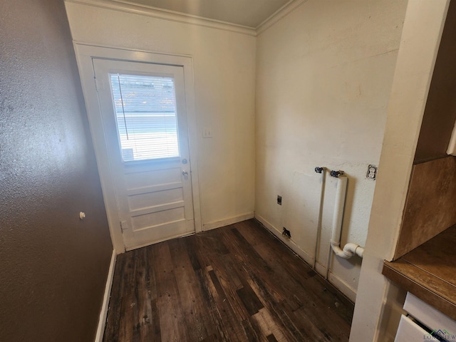 entryway with dark hardwood / wood-style floors and ornamental molding