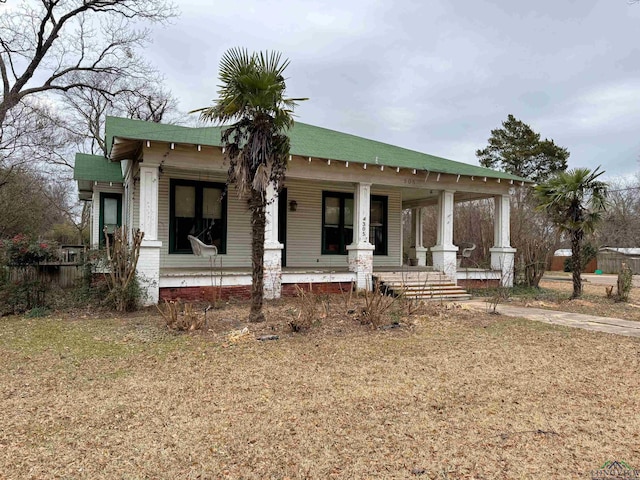 view of front facade with a porch and a front yard