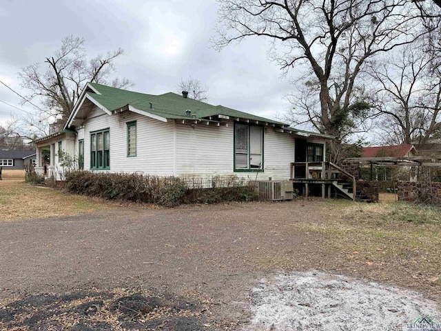 view of property exterior featuring central AC unit