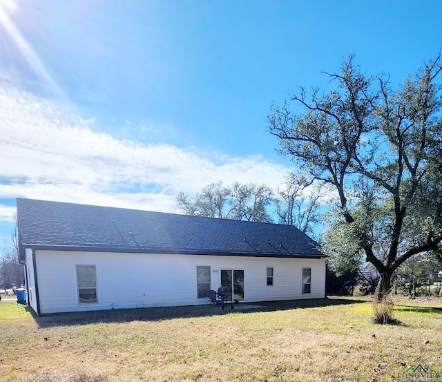 back of house with a yard