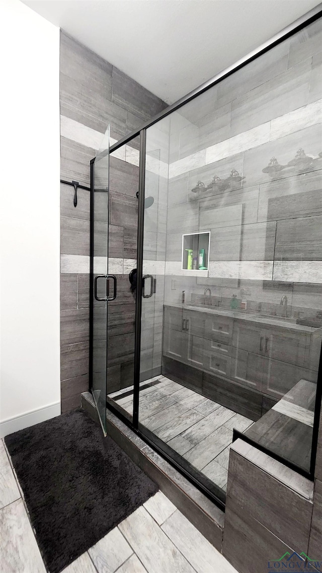 bathroom with sink and walk in shower