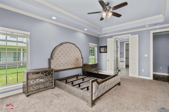 224 Stonegate Dr, Carthage, TX 75633 - carpeted bedroom with a raised ceiling, multiple windows, ornamental molding, recessed lighting, and a ceiling fan
