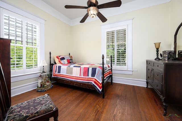 bedroom featuring ceiling fan and dark hardwood / wood-style floors