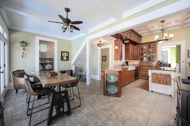 kitchen featuring ceiling fan with notable chandelier, crown molding, sink, decorative light fixtures, and light tile patterned flooring