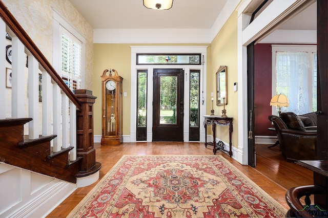 entryway with light hardwood / wood-style floors and baseboard heating