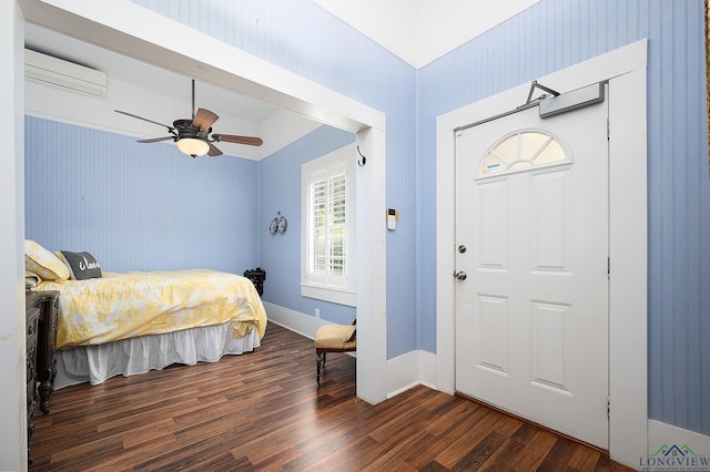 bedroom featuring a wall mounted air conditioner, ceiling fan, and dark wood-type flooring