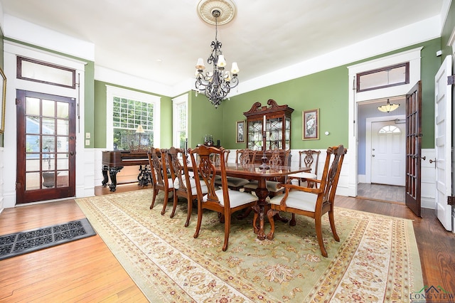 dining area featuring a chandelier and dark hardwood / wood-style floors