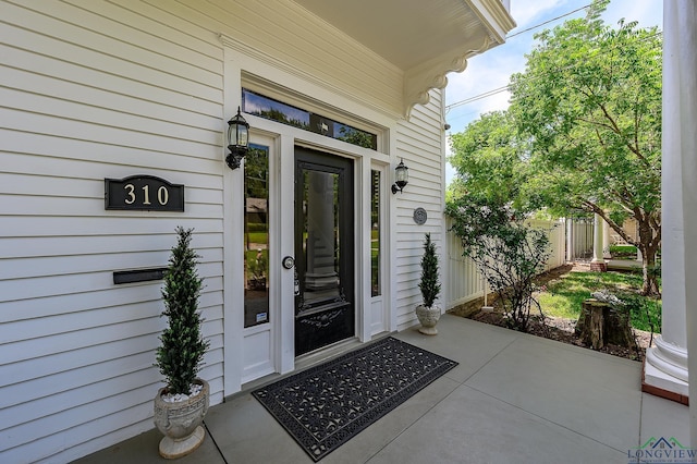 entrance to property with covered porch