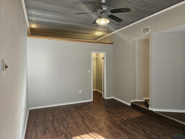 unfurnished room featuring dark hardwood / wood-style flooring, ceiling fan, ornamental molding, and wood ceiling