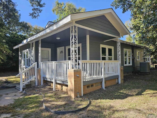 view of front of property featuring central air condition unit and covered porch