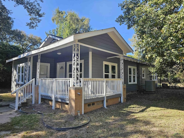 view of front of home featuring a porch and central AC unit