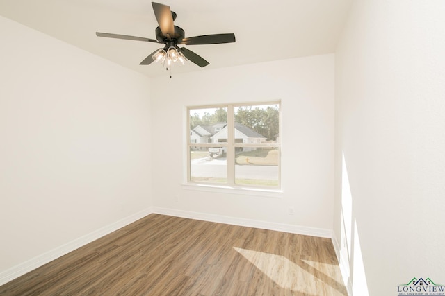 unfurnished room featuring ceiling fan and wood-type flooring