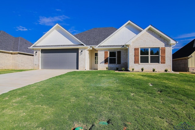 view of front of home featuring a garage and a front lawn