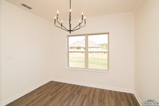 unfurnished dining area featuring dark hardwood / wood-style floors, plenty of natural light, and ornamental molding