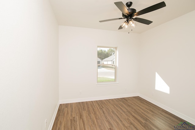 unfurnished room with ceiling fan and wood-type flooring