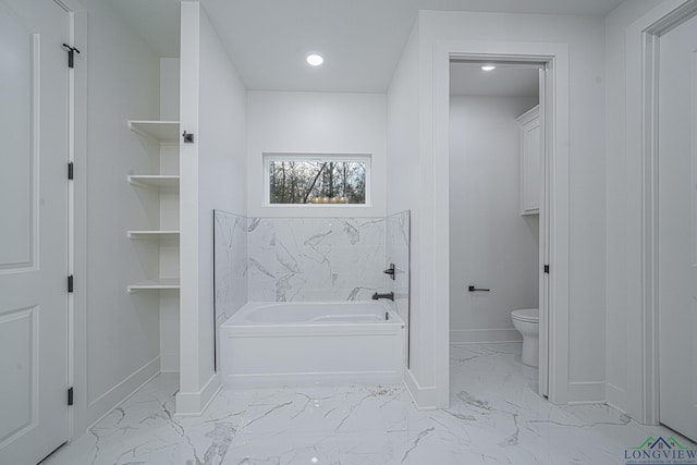 bathroom featuring toilet and a bath