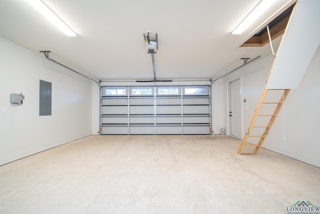 garage with a garage door opener and electric panel