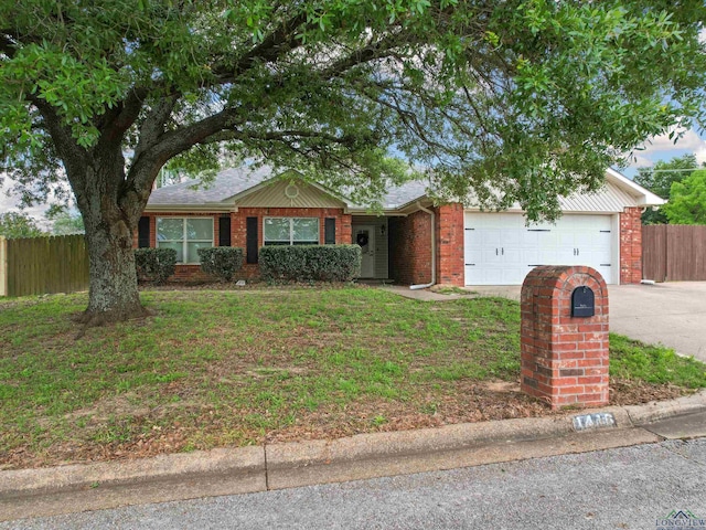 single story home with a garage, driveway, and brick siding