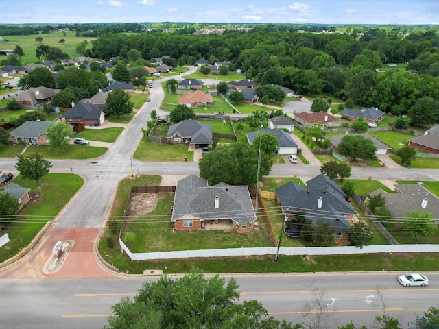 aerial overview of property's location with nearby suburban area