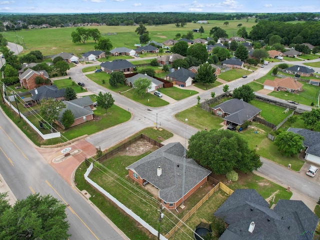 aerial view of property and surrounding area featuring nearby suburban area