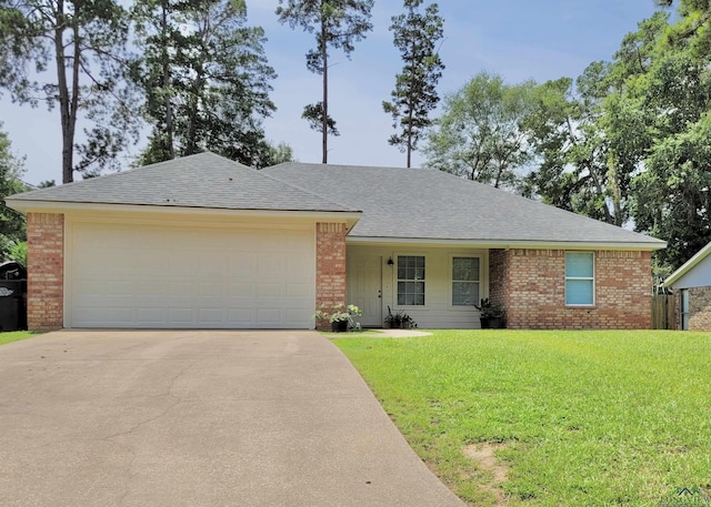 single story home with a garage and a front yard