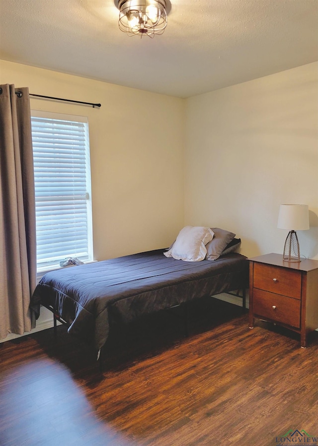 bedroom featuring dark wood-type flooring