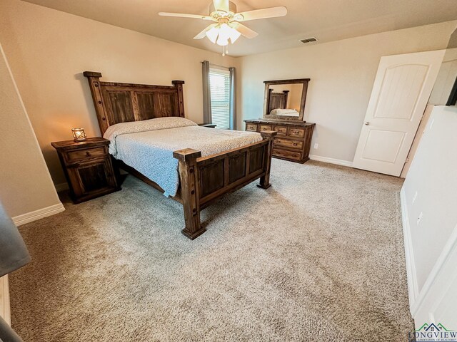 1126 Ruddy Duck, New Braunfels, TX 78130 - bedroom with light colored carpet, baseboards, and ceiling fan