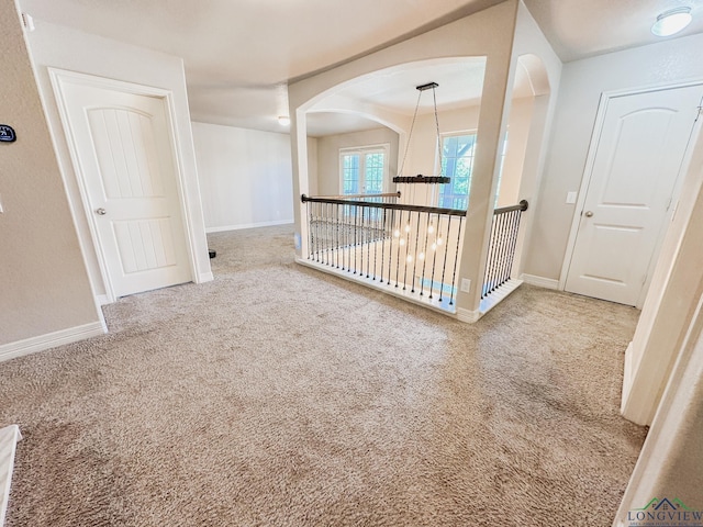 1126 Ruddy Duck, New Braunfels, TX 78130 - carpeted spare room with baseboards and arched walkways