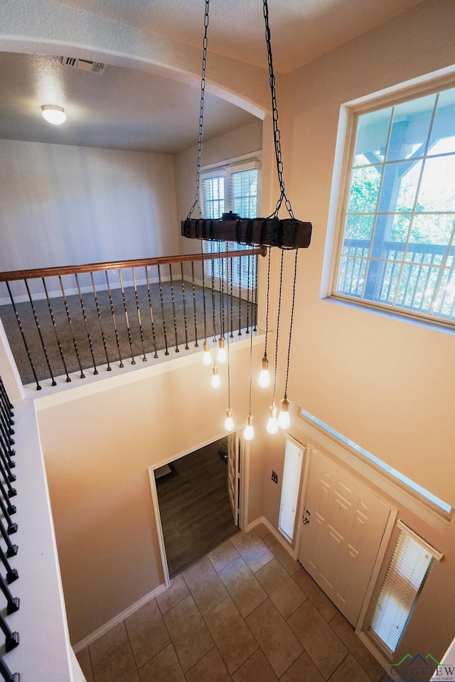 1126 Ruddy Duck, New Braunfels, TX 78130 - stairway with healthy amount of natural light, tile patterned floors, and baseboards