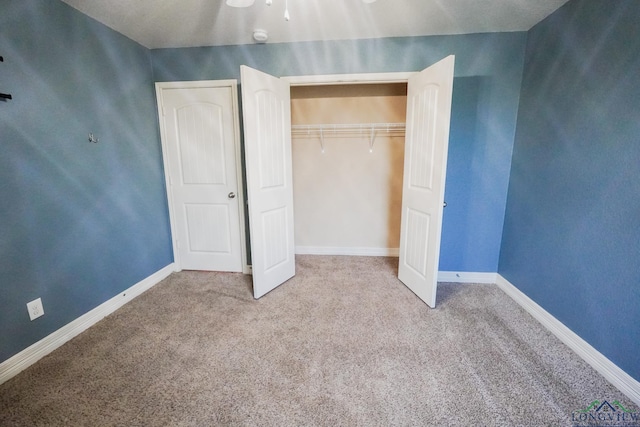 1126 Ruddy Duck, New Braunfels, TX 78130 - unfurnished bedroom with carpet flooring, baseboards, and a closet