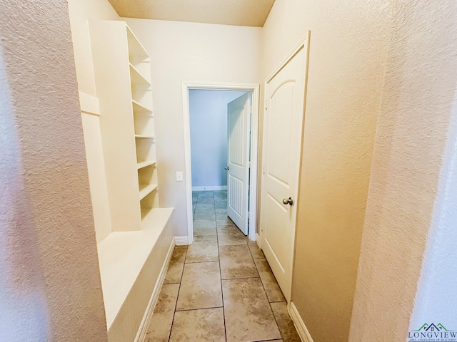 1126 Ruddy Duck, New Braunfels, TX 78130 - mudroom with a textured wall and light tile patterned floors