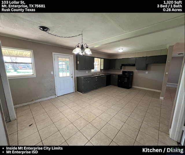 kitchen with light tile patterned floors, a textured ceiling, black / electric stove, and an inviting chandelier