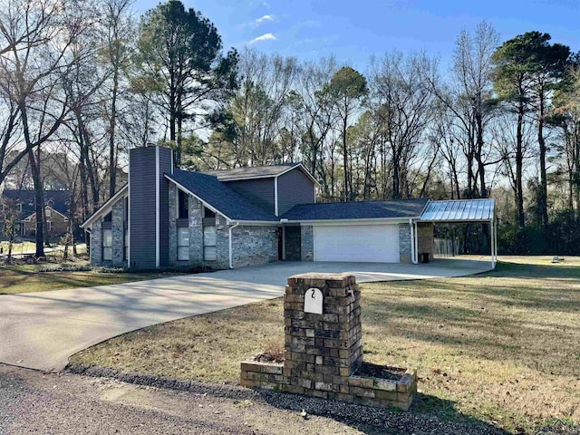 view of front of property with a front yard and a garage