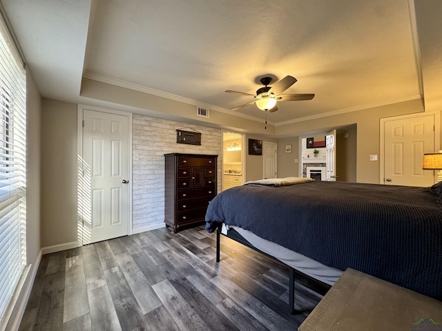 bedroom with ceiling fan, wood-type flooring, and crown molding