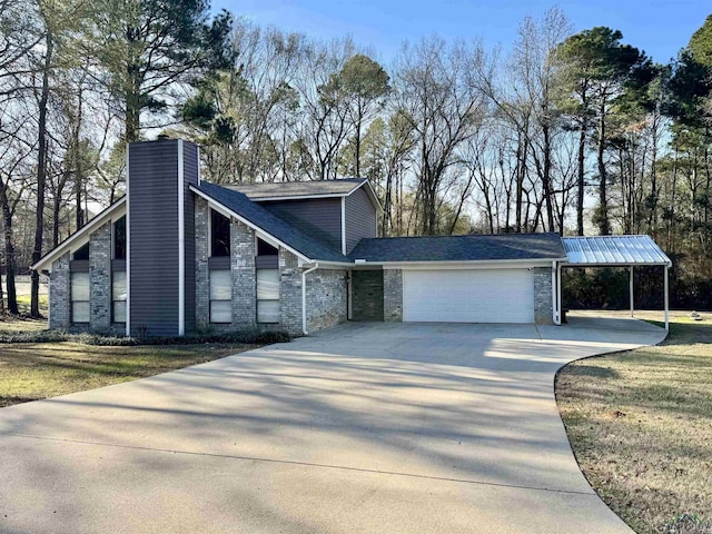 view of front of house with a garage and a front yard