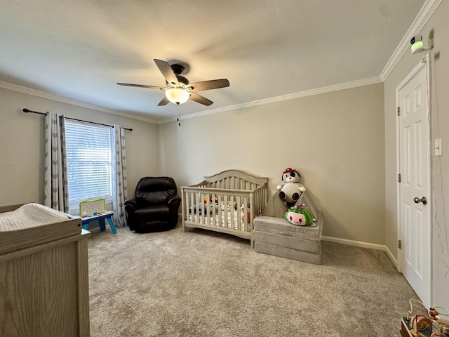 carpeted bedroom featuring ceiling fan, a nursery area, and ornamental molding