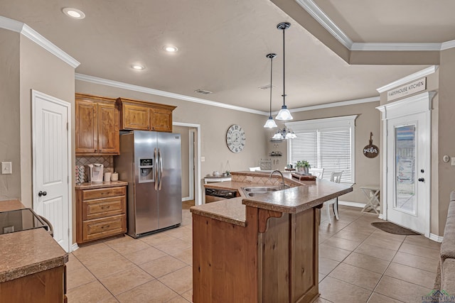 kitchen with stainless steel refrigerator with ice dispenser, backsplash, brown cabinetry, light tile patterned flooring, and a sink